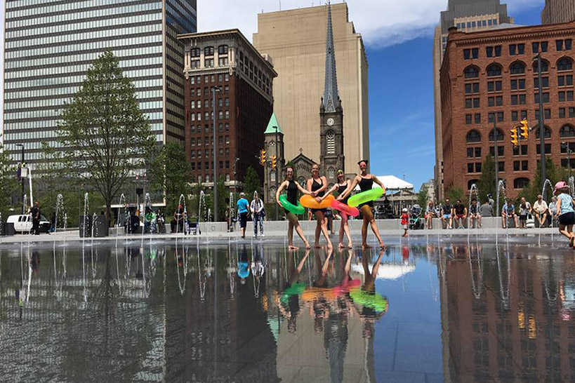 Image of 4 MorrisonDancers in pool floaties in Cleveland's public square