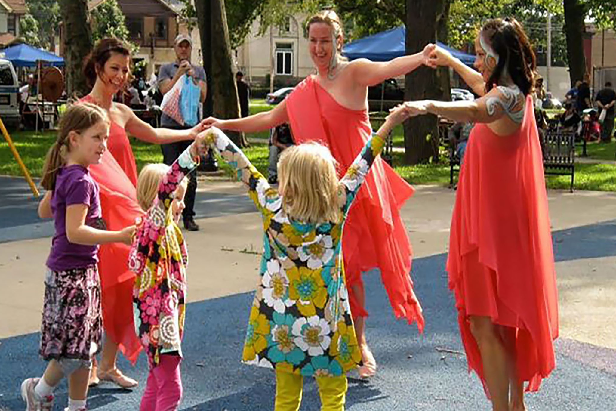Image of 3 MorrisonDancers dancing with children 